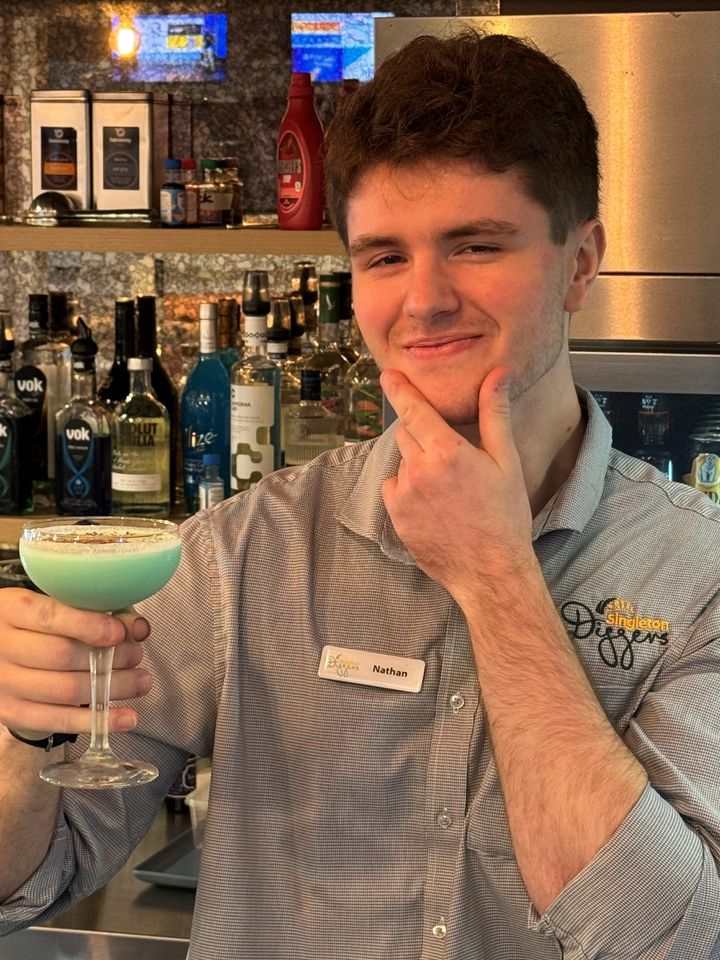 Featured image for “Nathan looking pretty pleased with his “Shamrock” Cocktail.”